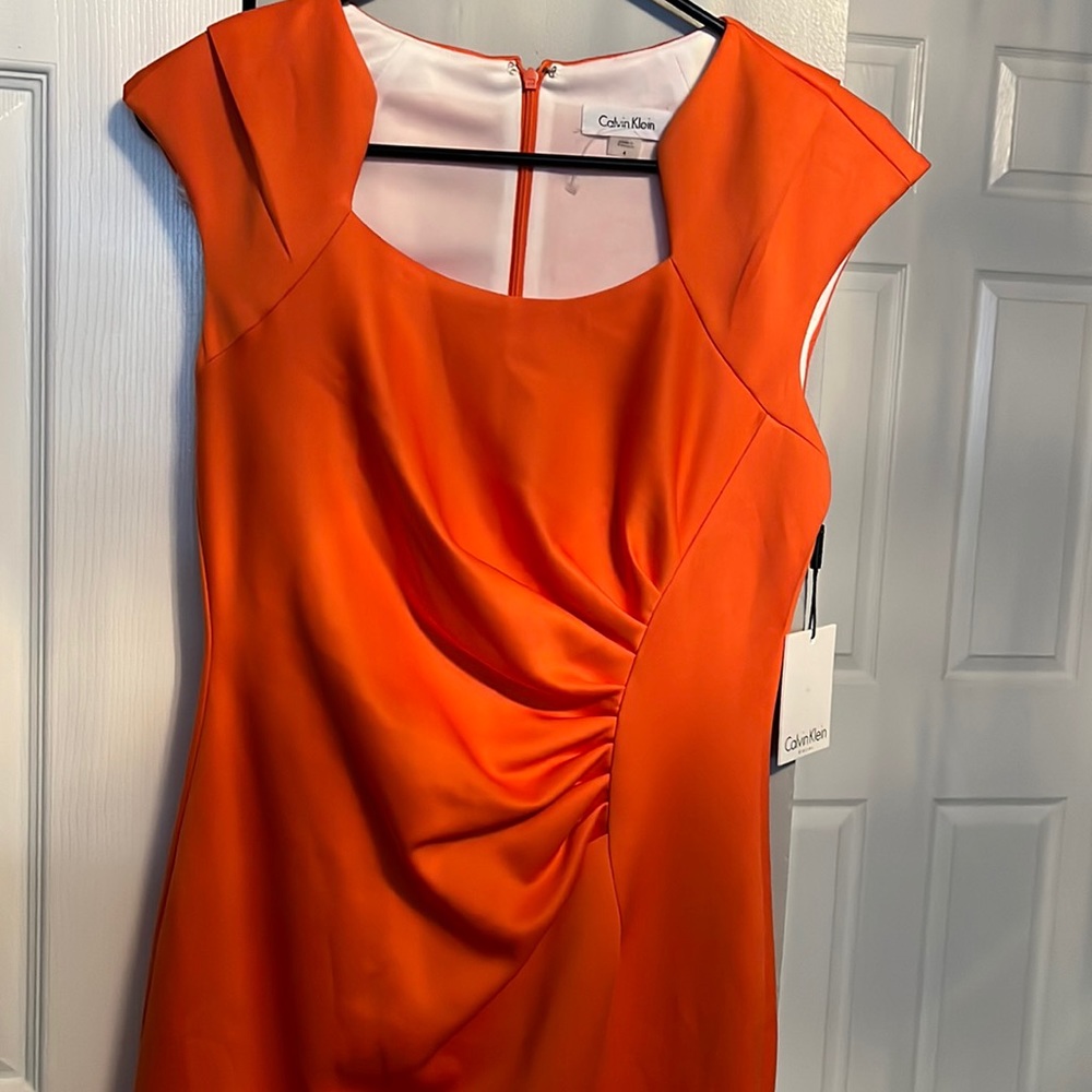 Selling this beautiful dress Calvin klein orange size 4 brand new